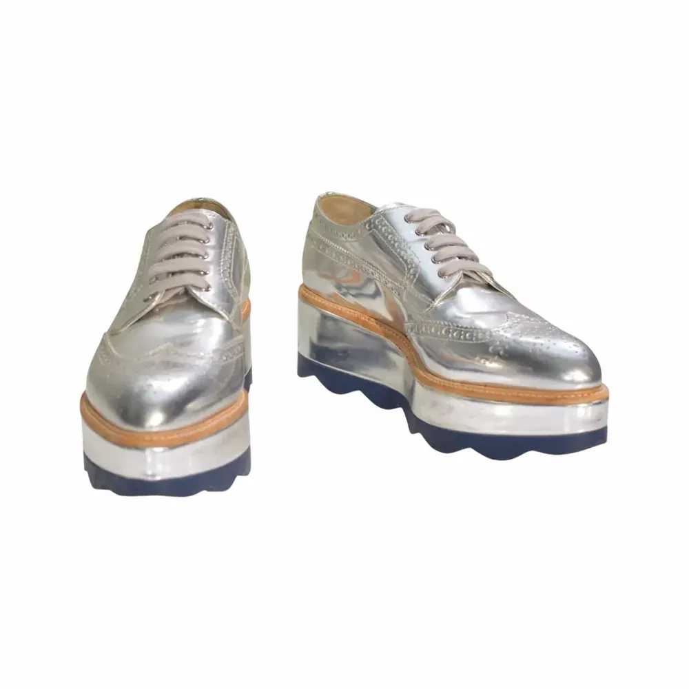 Prada Metallic Leather Wave Platform Brogues